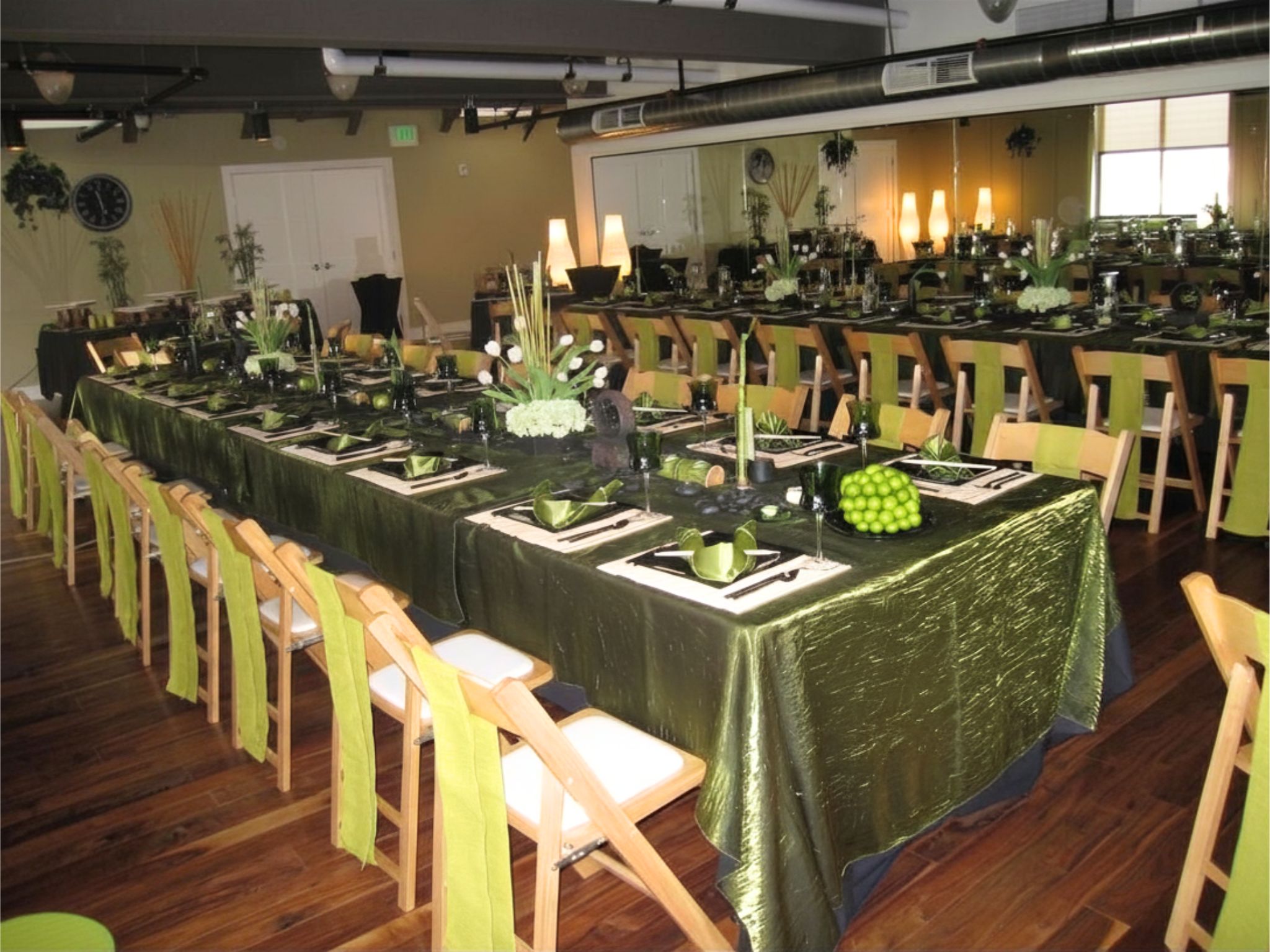 Tropical green banquet tablescape with bamboo accents